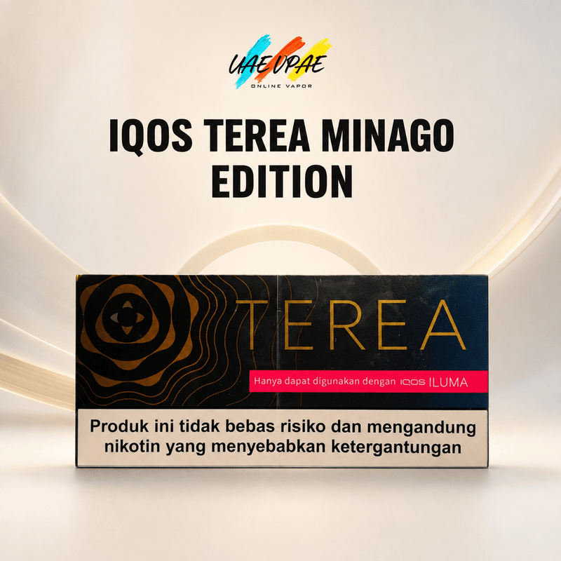 A product box for 'IQOS TEREA MINAGO EDITION' is displayed against a clean, light beige background with subtle curved lines. The box is black with gold wave patterns, gold 'TEREA' lettering, a pink banner, and a beige warning label at the bottom.