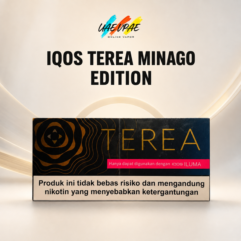A product box for 'IQOS TEREA MINAGO EDITION' is displayed against a clean, light beige background with subtle curved lines. The box is black with gold wave patterns, gold 'TEREA' lettering, a pink banner, and a beige warning label at the bottom.