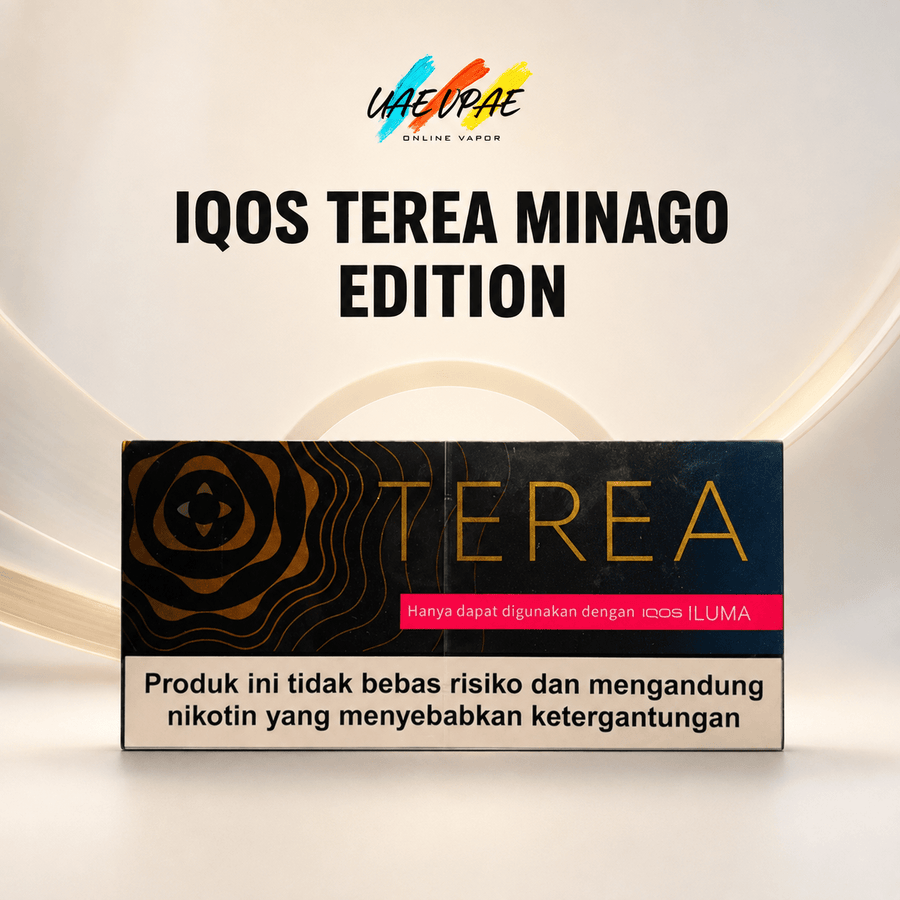 A product box for 'IQOS TEREA MINAGO EDITION' is displayed against a clean, light beige background with subtle curved lines. The box is black with gold wave patterns, gold 'TEREA' lettering, a pink banner, and a beige warning label at the bottom.